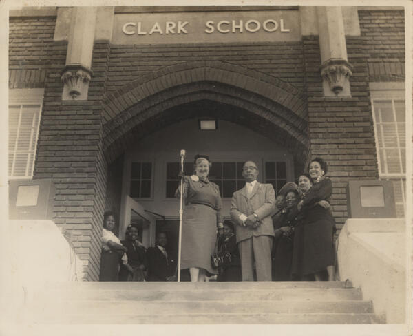 Eleona Brinsmade, visiting teacher with the Monroe City School System, stands left of B.D. Robinson, principal. The photo was taken for the opening of Clark School (originally Monroe Colored High) after redecorating for the 1953-54 school year. 
